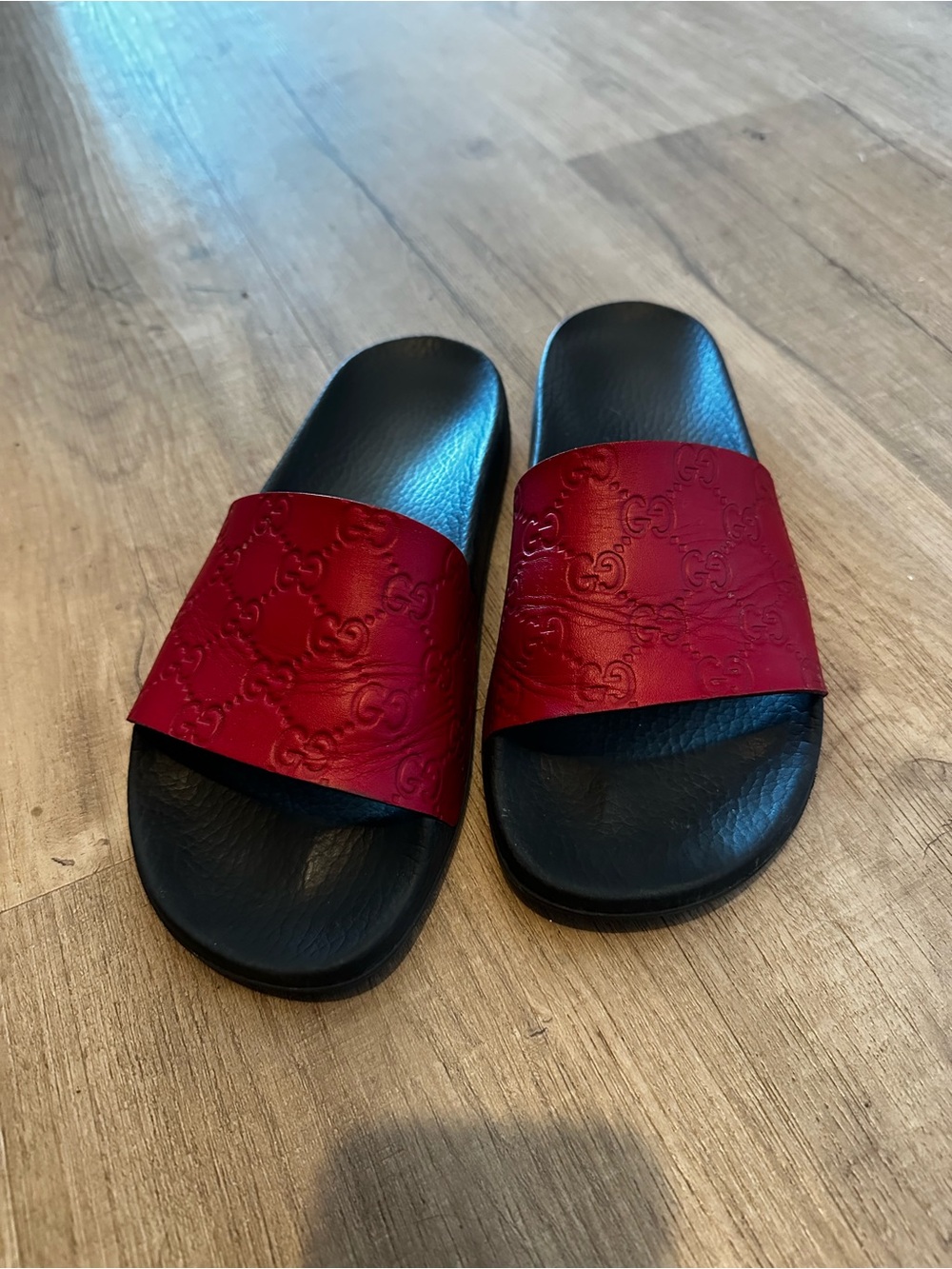 Gucci Red Leather Embossed GG Slide Sandals with Black Footbed